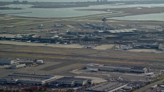 AX120_049 - 5.5K aerial stock footage of John F. Kennedy International Airport in Autumn, in New York