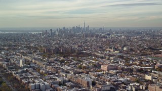 AX120_080 - 5.5K aerial stock footage of Lower Manhattan skyline seen from Brooklyn in Autumn, New York City