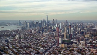 AX120_084 - 5.5K stock footage aerial video of Downtown Brooklyn and Lower Manhattan skylines in Autumn, New York City