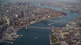 AX120_094 - 5.5K aerial stock footage of a view of the Brooklyn and Manhattan Bridges in Autumn, New York City