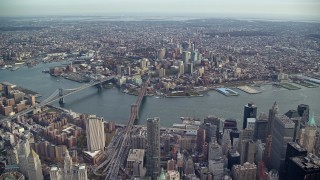 AX120_105 - 5.5K stock footage aerial video of the Brooklyn Bridge, Manhattan Bridge and Brooklyn skyscrapers, New York City