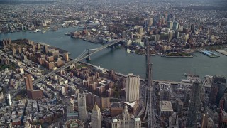 AX120_112E - 5.5K aerial stock footage of a wide view of the Brooklyn Bridge and Manhattan Bridge in New York City