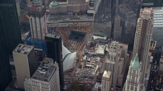AX120_115 - 5.5K aerial stock footage orbit World Trade Center Memorial in Lower Manhattan, New York City