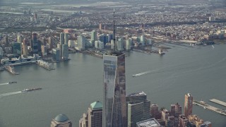 AX120_116 - 5.5K aerial stock footage orbit One World Trade Center in Lower Manhattan, Jersey City in the background, New York City