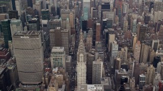 AX120_158E - 5.5K aerial stock footage of Chrysler Building and Midtown High-Rises, New York City