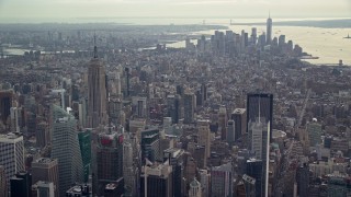 AX120_171 - 5.5K aerial stock footage of Lower Manhattan high-rises and Empire State Building, New York City