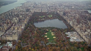 AX120_195E - 5.5K stock footage aerial video approach the reservoir and The Met in Central Park, New York City