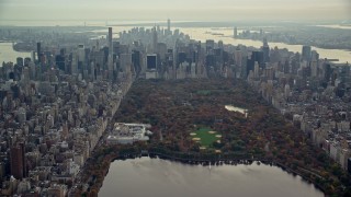 AX120_202E - 5.5K aerial stock footage of The Met, Central Park and Midtown skyscrapers in New York City
