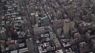 AX120_231 - 5.5K aerial stock footage fly over apartment buildings and streets on Upper East Side, New York City