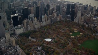 AX120_234 - 5.5K stock footage aerial video approach Wollman Rink in Central Park in Autumn, New York City
