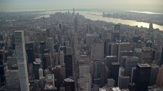 AX120_235 - 5.5K aerial stock footage fly over Midtown toward Empire State Building, New York City