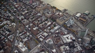 AX120_241 - 5.5K aerial stock footage of office and apartment buildings in Greenwich Village in Autumn, New York City