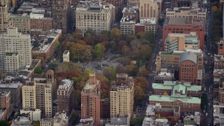 AX120_243 - 5.5K aerial stock footage orbit Washington Square Park in Autumn, Greenwich Village, New York City