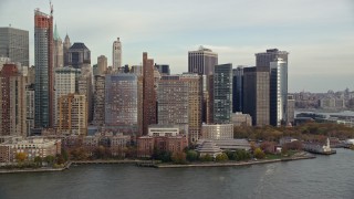 AX120_249 - 5.5K stock footage aerial video of Battery Park and riverfront high-rises in Autumn, Lower Manhattan, New York City