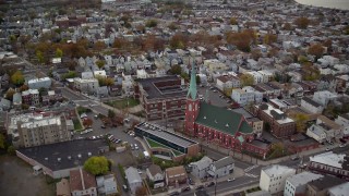 AX120_268 - 5.5K aerial stock footage orbit a church and high school in Autumn, Jersey City, New Jersey