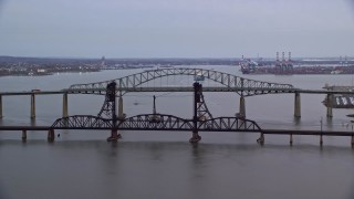 AX121_005E - 5.5K aerial stock footage of the Newark Bay Bridge and Lehigh Valley Bridge at twilight, New Jersey