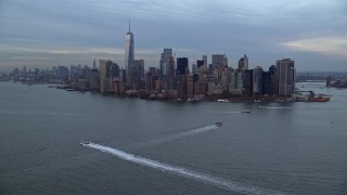 AX121_016E - 5.5K stock footage aerial video of the Lower Manhattan skyline at twilight in Autumn, New York City