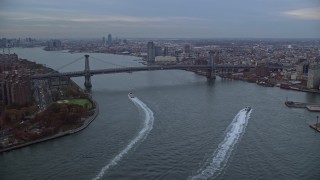AX121_026 - 5.5K aerial stock footage of approaching the Williamsburg Bridge at twilight in New York City