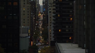 AX121_065E - 5.5K aerial stock footage of high-rises and congested streets in Midtown at twilight in New York City