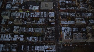 AX121_095 - 5.5K aerial stock footage of a bird's eye of row houses and streets on the Upper West Side at twilight, New York City