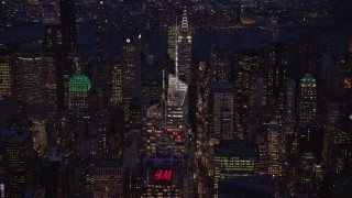 AX121_132 - 5.5K aerial stock footage of Bank of America Tower in Midtown at Night in New York City