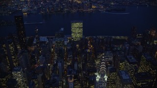 AX121_137E - 5.5K aerial stock footage approach Chrysler Building at Night in New York City