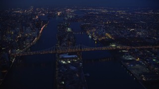 AX121_141 - 5.5K aerial stock footage orbit Queensboro Bridge and Roosevelt Island at Night in New York City