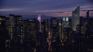 AX121_148E - 5.5K aerial stock footage of 432 Park Avenue and Citigroup Center skyscrapers at Night in Midtown, New York City