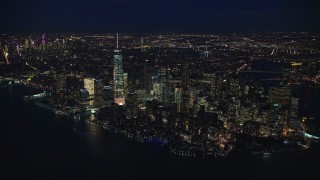 AX121_171E - 5.5K stock footage aerial video approach Lower Manhattan at Night, New York City
