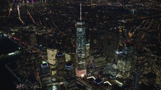 AX121_174 - 5.5K aerial stock footage of a slow approach to the top of Freedom Tower at Night in Lower Manhattan, New York City