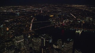 AX121_184 - 5.5K aerial stock footage orbit Brooklyn and Manhattan Bridges at Night in New York City