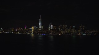 AX122_024E - 5.5K stock footage aerial video of the Lower Manhattan skyline at Night, New York City