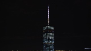 AX122_032E - 5.5K aerial stock footage orbit spire atop Freedom Tower at Night in Lower Manhattan, NYC