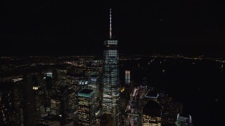 AX122_034E - 5.5K aerial stock footage orbiting Freedom Tower, World Trade Center skyscrapers at Night in Lower Manhattan, NYC