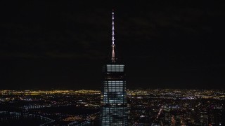 AX122_038 - 5.5K aerial stock footage orbit spire of One World Trade Center at Night in Lower Manhattan, NYC