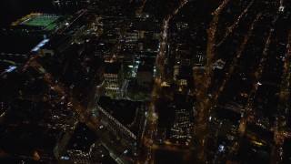 AX122_049 - 5.5K aerial stock footage orbit Soho office buildings at Night in Lower Manhattan, New York City