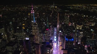AX122_117 - 5.5K aerial stock footage of circling over Times Square in Midtown at Night, New York City