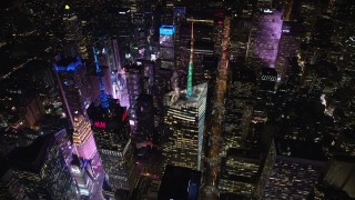 AX122_121 - 5.5K aerial stock footage orbit the Bank of America Tower and Times Square at Night in Midtown, NYC