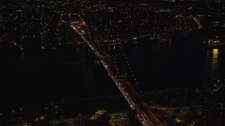 AX122_241 - 5.5K aerial stock footage approach and orbit Williamsburg Bridge at Night in New York City
