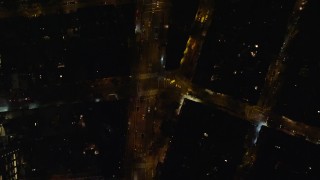 AX122_247 - 5.5K aerial stock footage of a bird's eye view of Avenue of the Americas at Night in Soho, New York City
