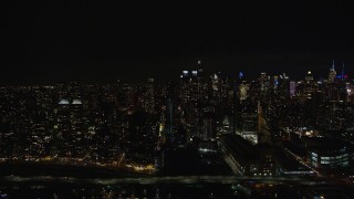 AX123_013E - 5.5K aerial stock footage of Midtown Manhattan and Upper West Side skyscrapers at Night in New York City