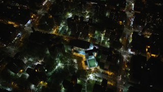 AX123_048 - 5.5K aerial stock footage tilt to bird's eye of public housing complex in Harlem at Night, New York City