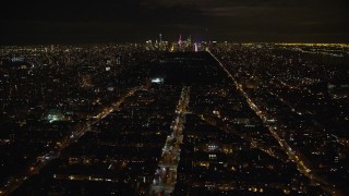 AX123_049 - 5.5K aerial stock footage fly over 7th Avenue toward Central Park and Midtown at Night, New York City
