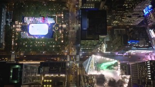 AX123_063E - 5.5K stock footage aerial video of a bird's eye view of 6th Avenue in Midtown at Nighttime in New York City