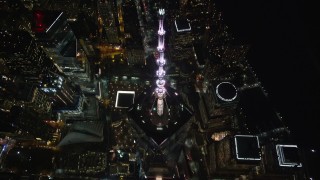 AX123_084 - 5.5K stock footage aerial video approach Freedom Tower and tilt to reveal the Memorial at Night, Lower Manhattan, NYC