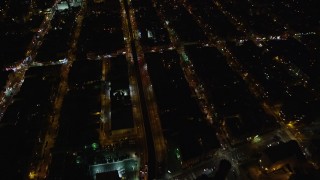AX123_124E - 5.5K aerial stock footage of a bird's eye of Atlantic Avenue at Night in Brooklyn in New York City