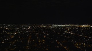 AX123_143E - 5.5K aerial stock footage of a wide view of JFK International Airport at Night in New York City