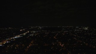 AX123_147 - 5.5K aerial stock footage fly over suburban neighborhoods at Night in Elmont, Long Island, New York