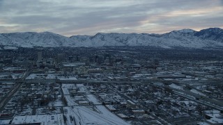 AX124_006 - 5.5K stock footage aerial video approach Downtown Salt Lake City at Sunrise in Winter in Utah