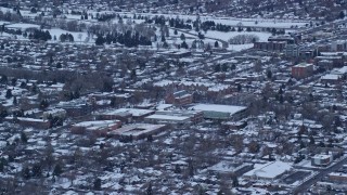 AX124_015 - 5.5K aerial stock footage of Westminster College at Sunrise in Winter in Salt Lake City, Utah
